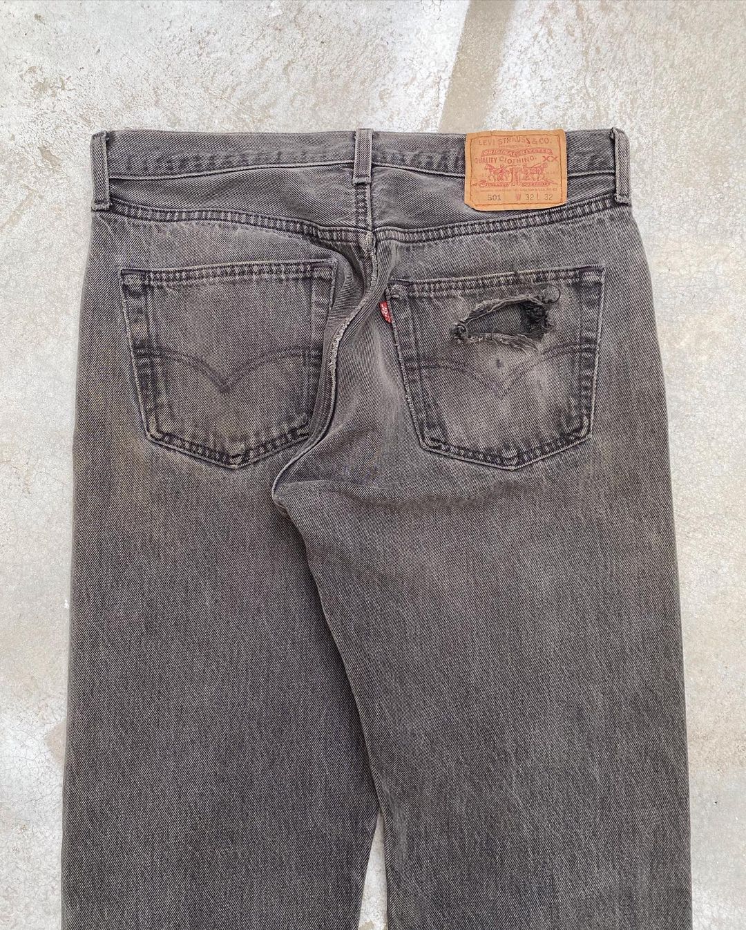 1990s Faded Black Levi’s 501 Repaired Jeans