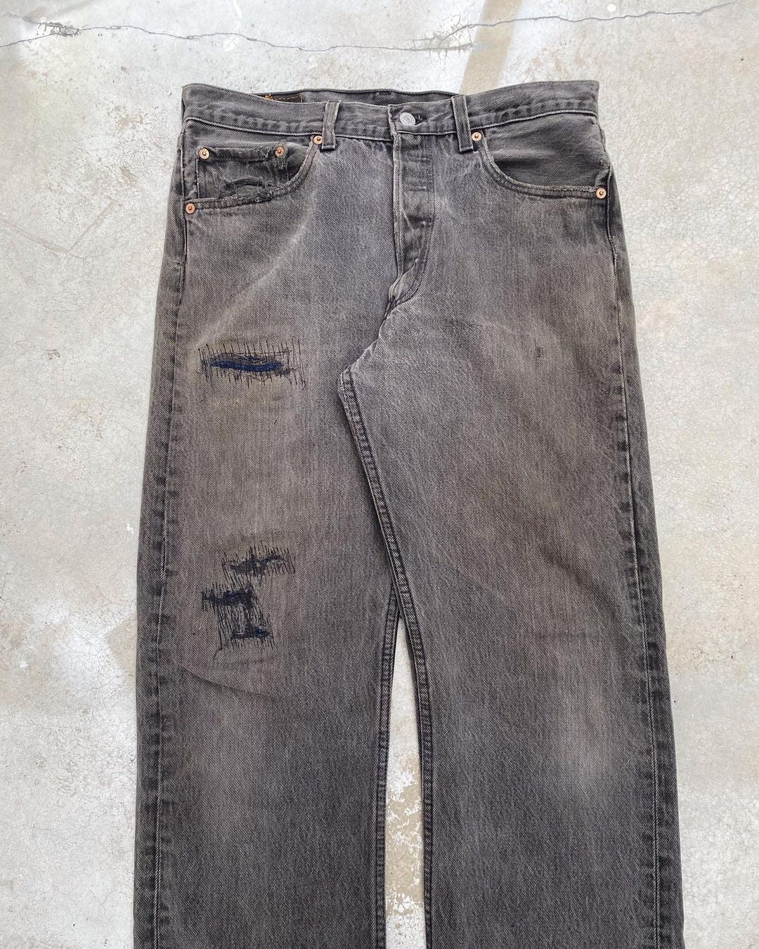 1990s Faded Black Levi’s 501 Repaired Jeans