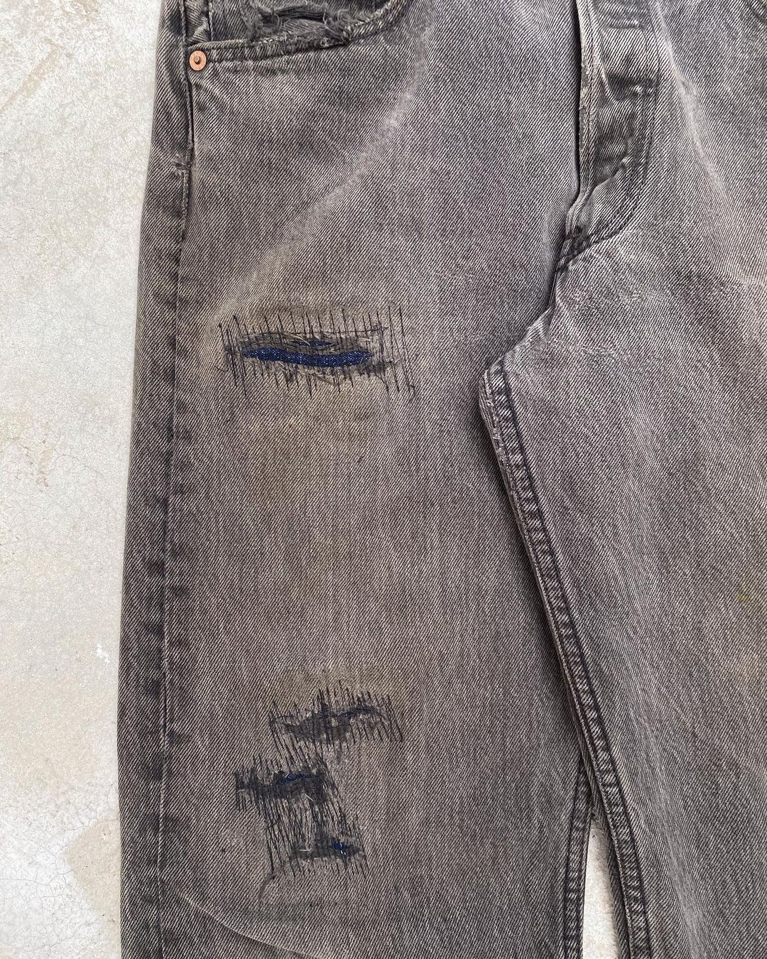 1990s Faded Black Levi’s 501 Repaired Jeans