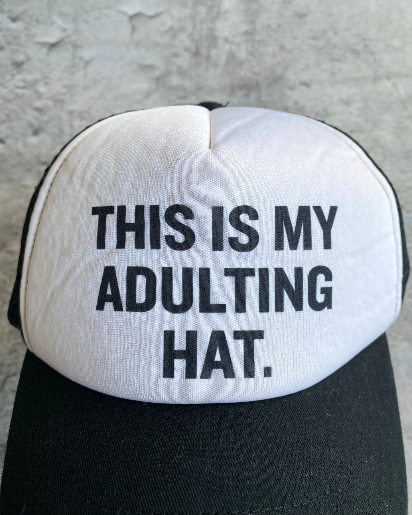 ‘THIS IS MY ADULTING HAT’ TRUCKER HAT