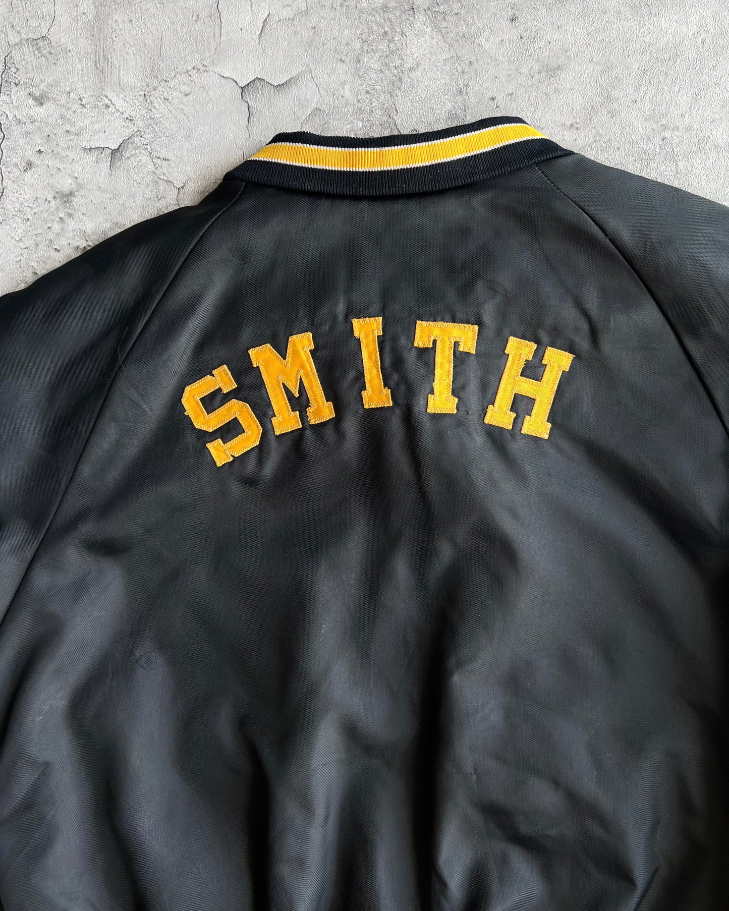 1970S BLACK 'PIRATES' RAGLAN VARSITY JACKET (L)