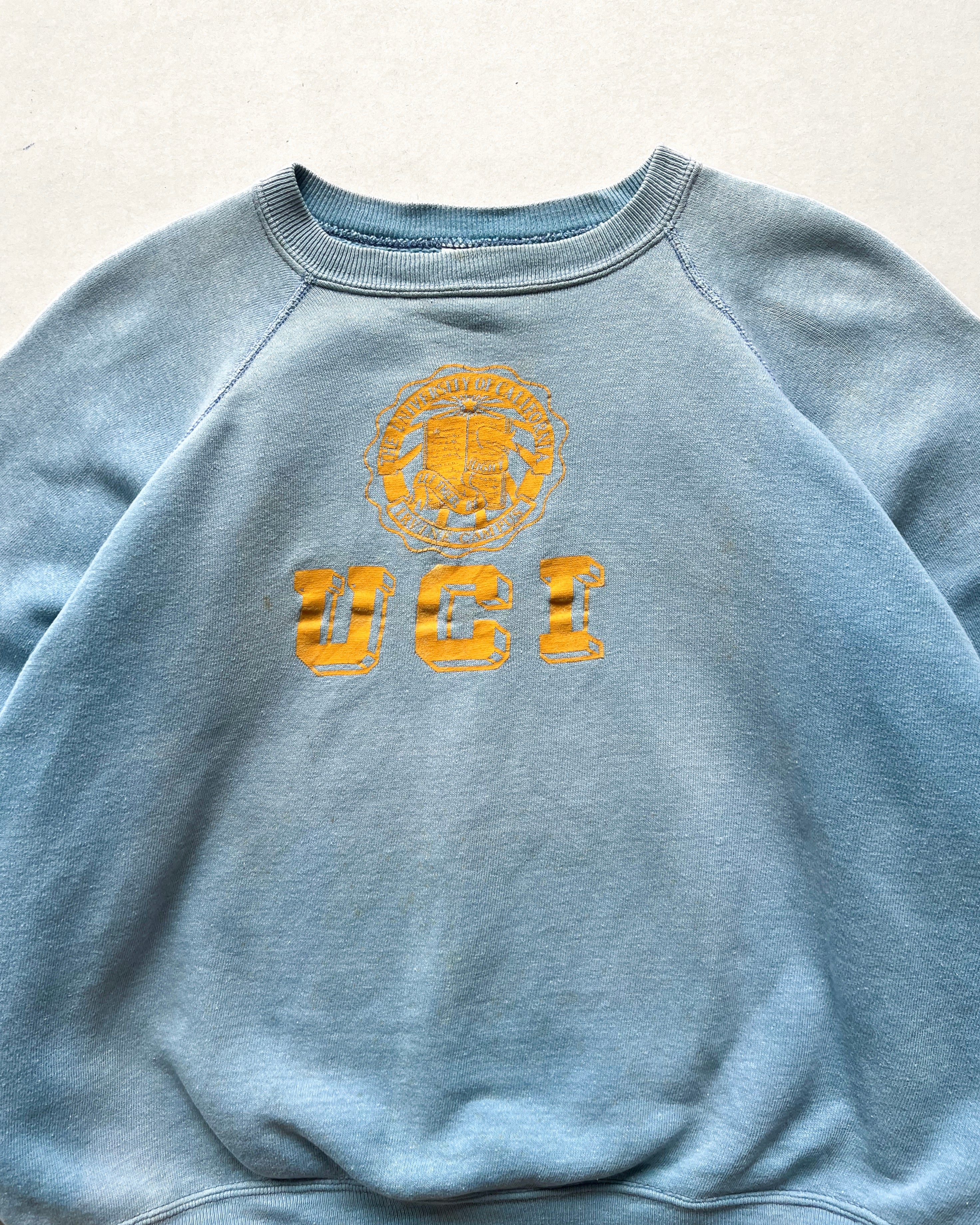 1960S FADED 'UCI' RAGLAN SWEATSHIRT (XL)