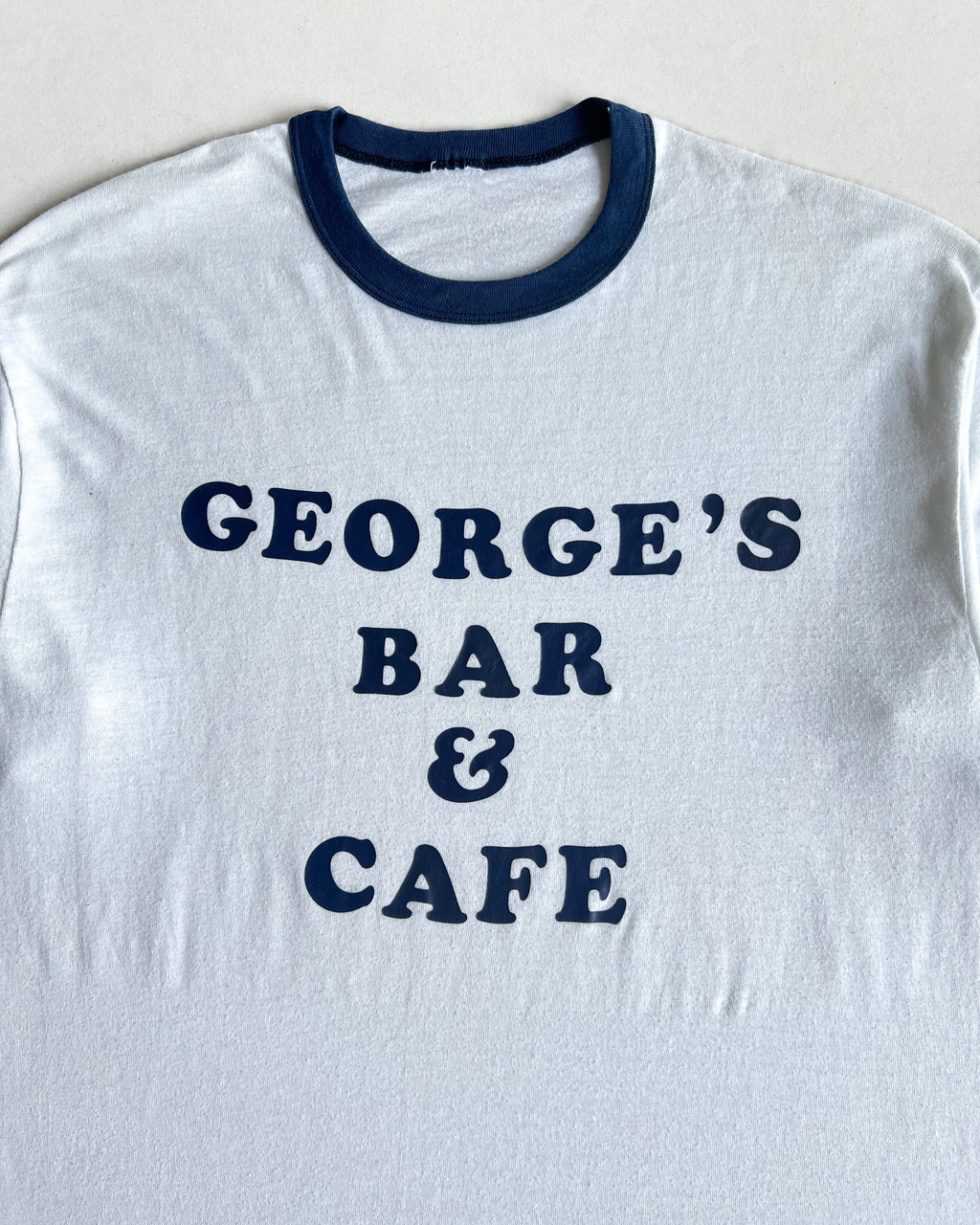 1980S 'GEORGE'S BAR AND CAFE' SINGLE STITCH RINGER TEE (L)