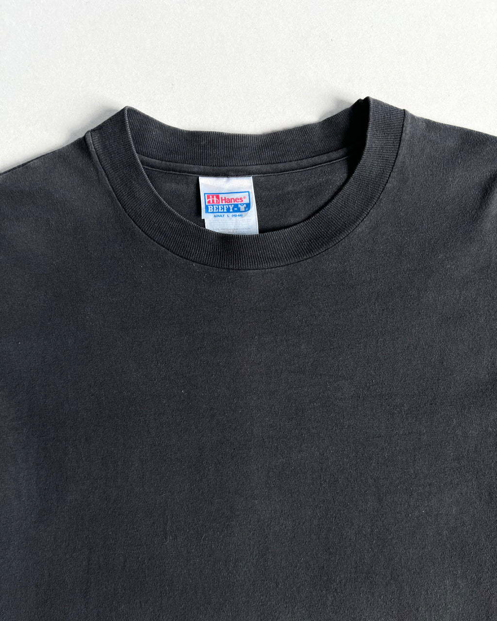 1990S FADED BLACK HANES SINGLE STITCH BLANK TEE (L)