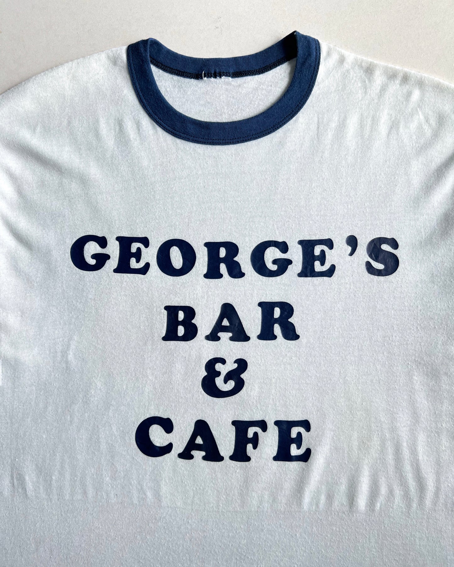 1980S 'GEORGE'S BAR AND CAFE' SINGLE STITCH RINGER TEE (L)