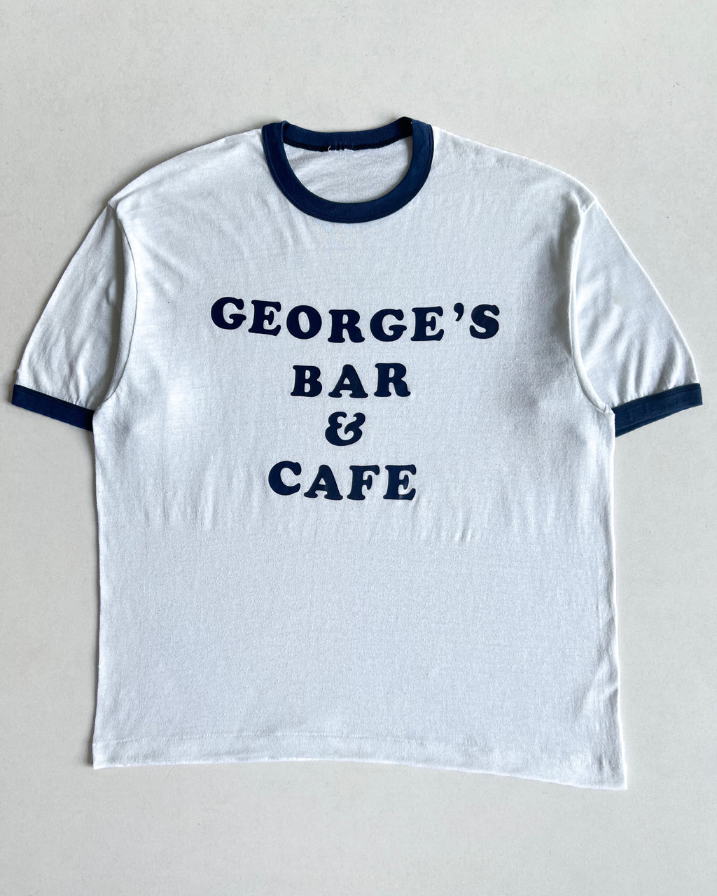 1980S 'GEORGE'S BAR AND CAFE' SINGLE STITCH RINGER TEE (L)
