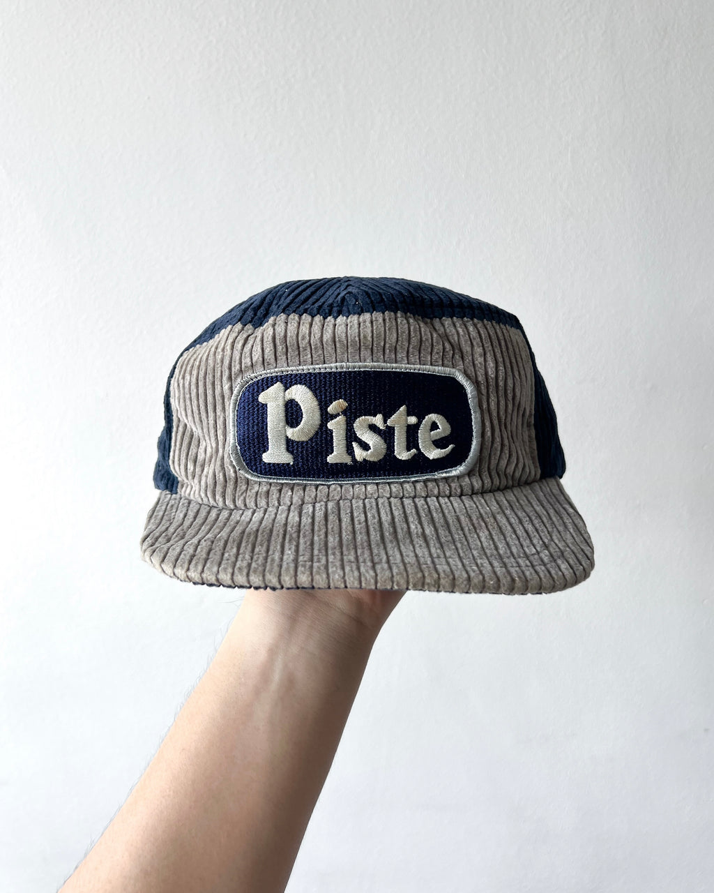 1990S SALOMON 'PISTE' CORDUROY TRUCKER CAP (OS)