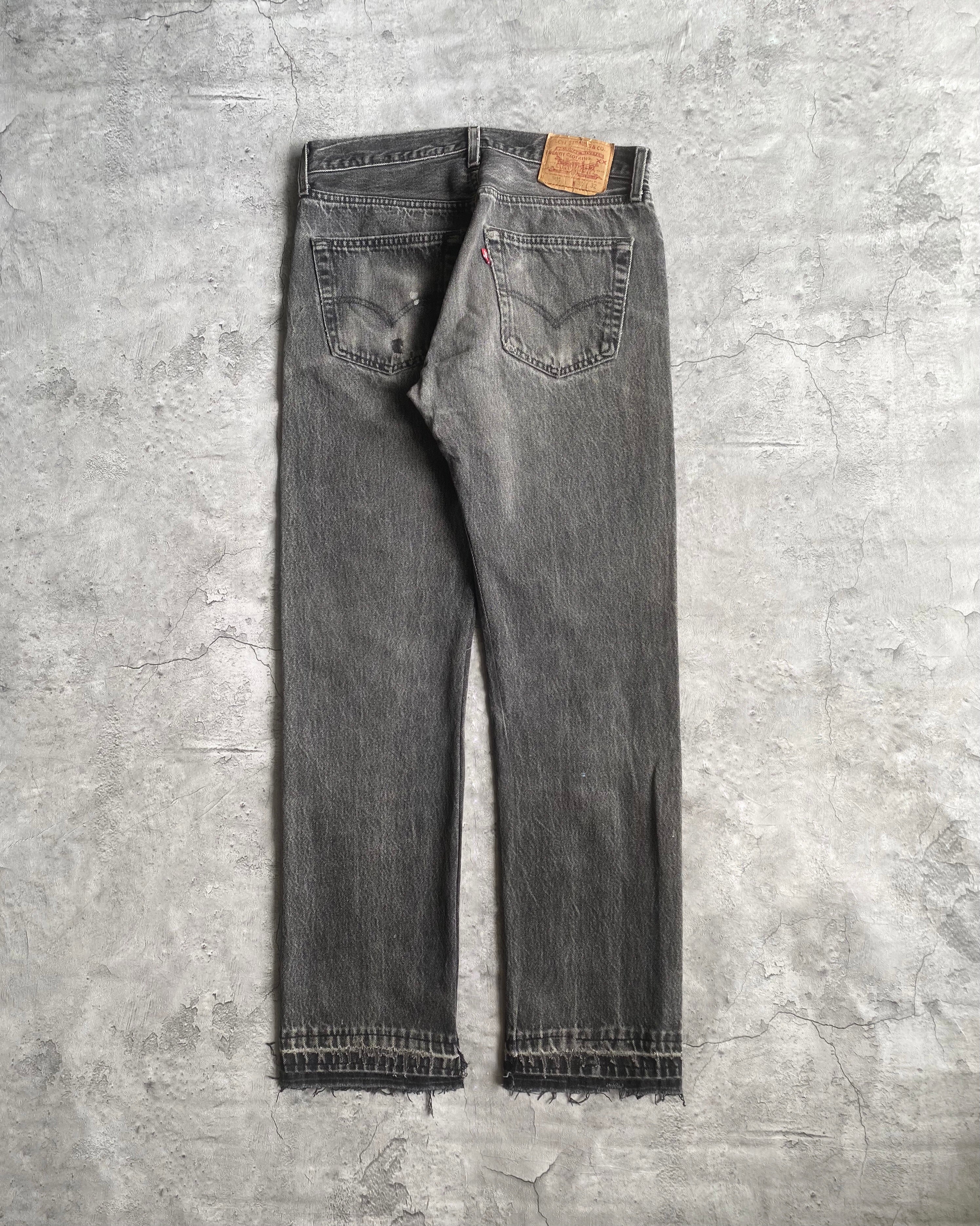 1990S REPAIRED BLACK LEVI'S 501 RELEASED HEM JEANS (31X32)