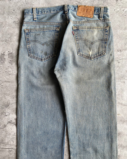 1990S FADED BLUE LEVI'S 501 DISTRESSED JEANS (33X30)