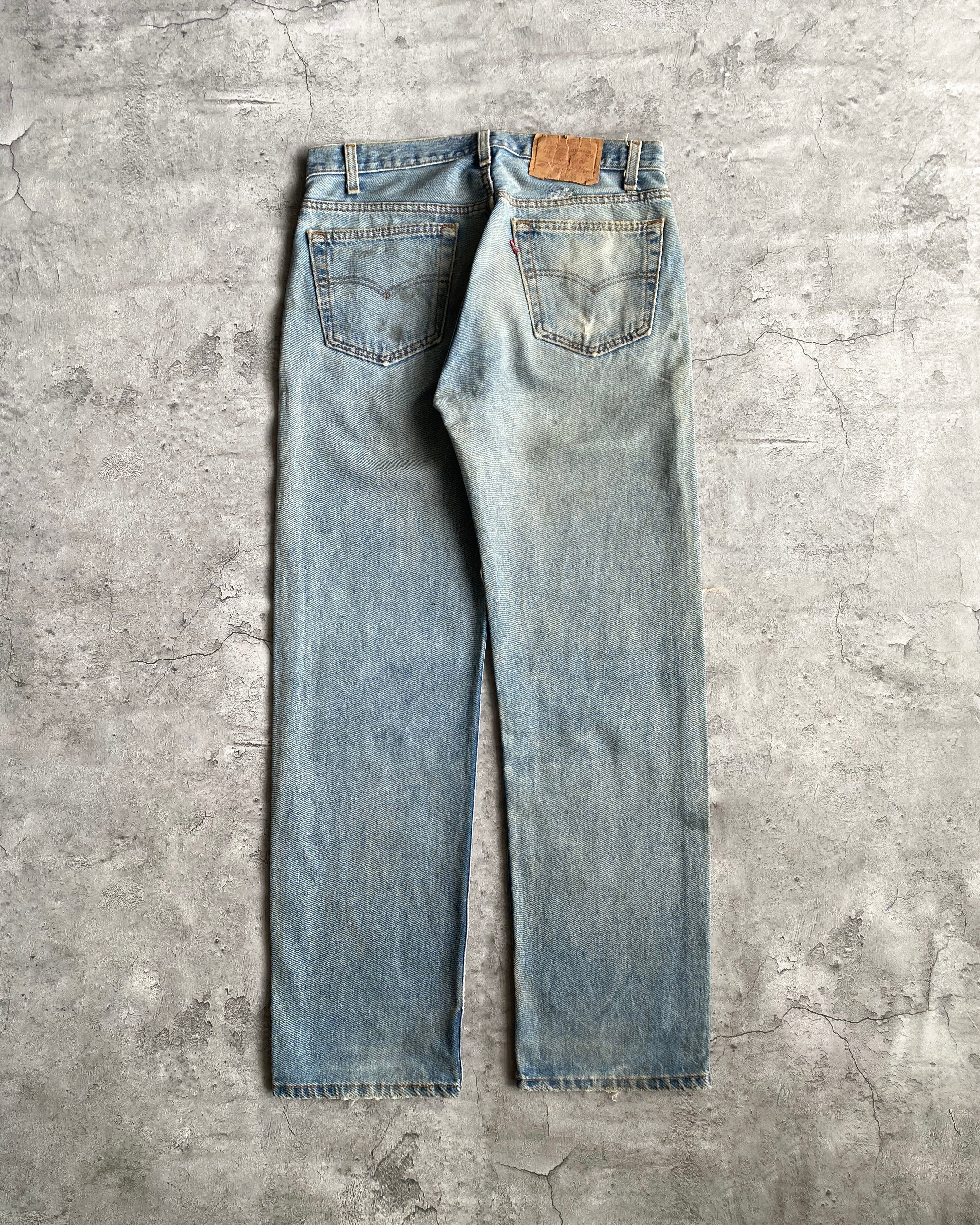 1990S FADED BLUE LEVI'S 501 DISTRESSED JEANS (33X30)