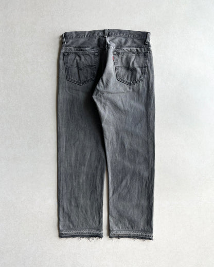 1980S FADED BLACK LEVI'S 501 RELEASED HEM JEANS (33X28)