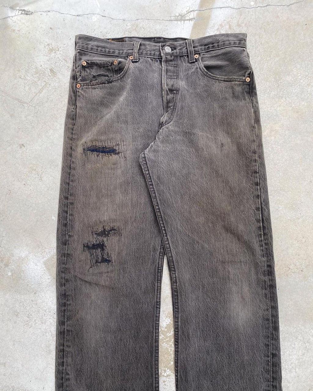 1990s Faded Black Levi’s 501 Repaired Jeans