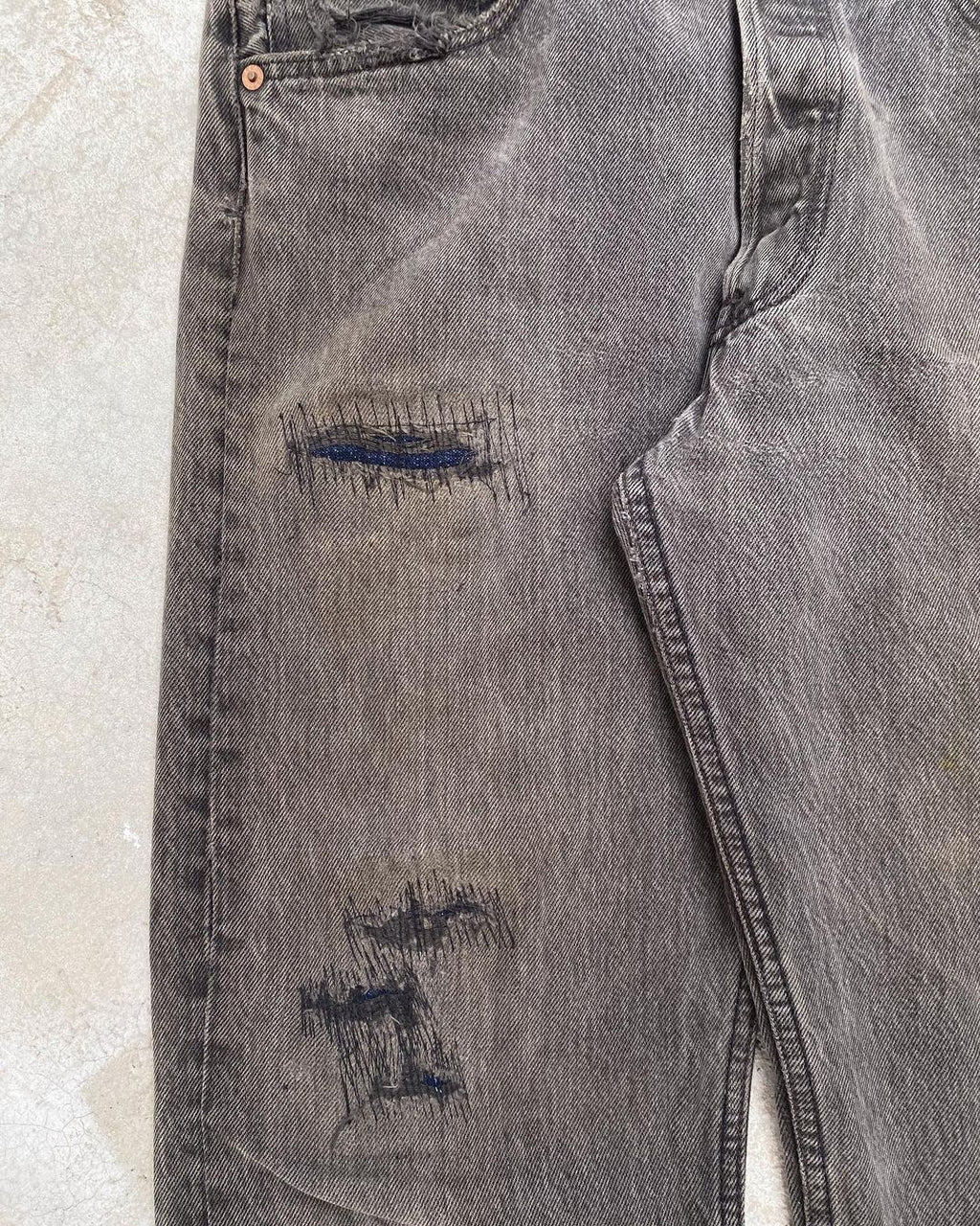 1990s Faded Black Levi’s 501 Repaired Jeans