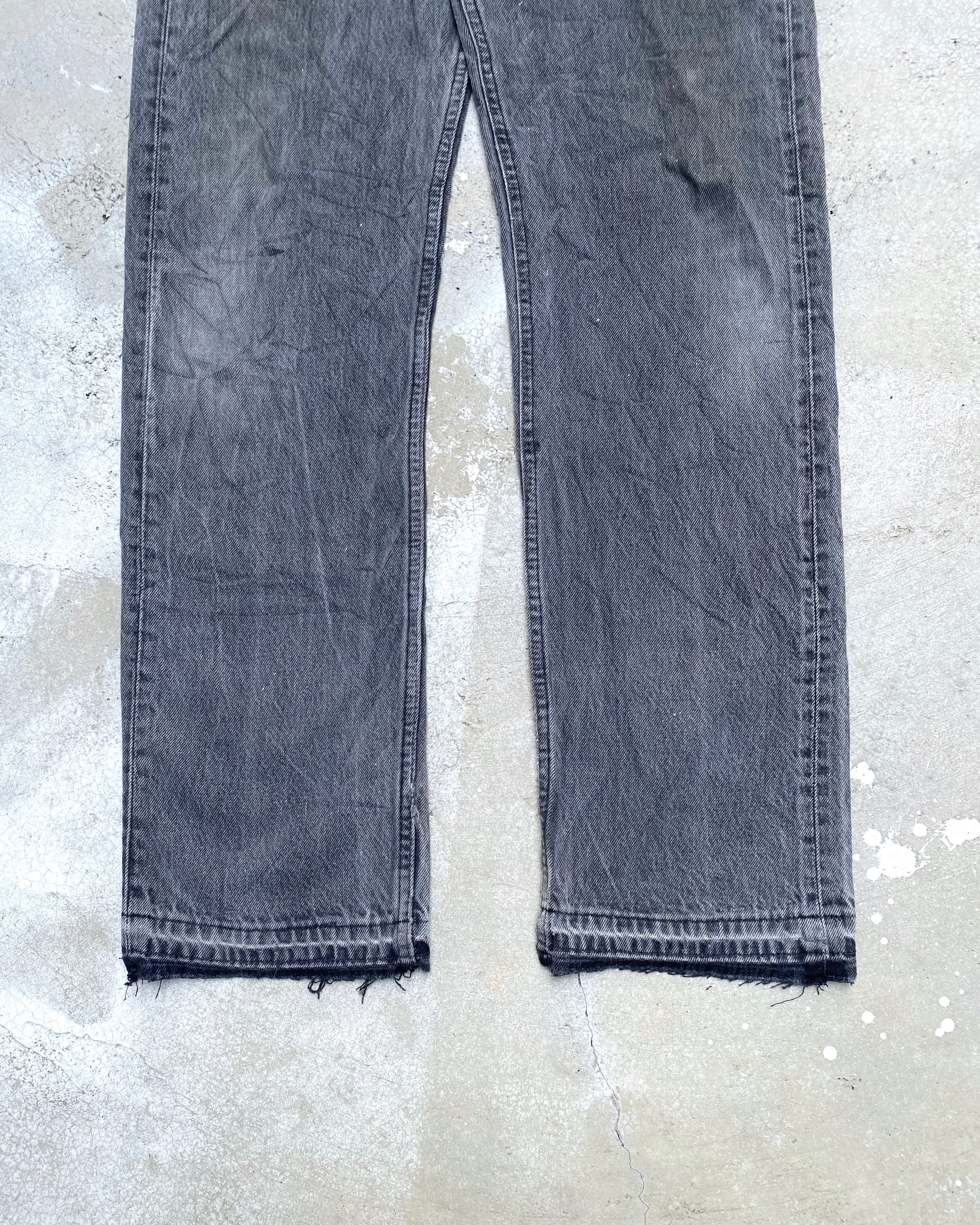 1990S FADED BLACK LEVI'S 501 RELEASED HEM JEANS (31X32)