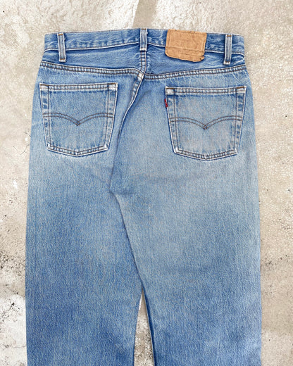 1980S FADED BLUE LEVI'S 501 PATCHED JEANS (31X32)