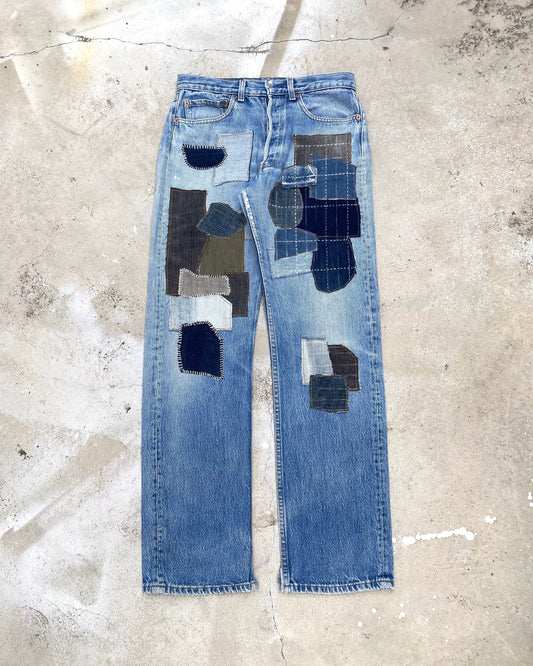 1980S FADED BLUE LEVI'S 501 PATCHED JEANS (31X32)