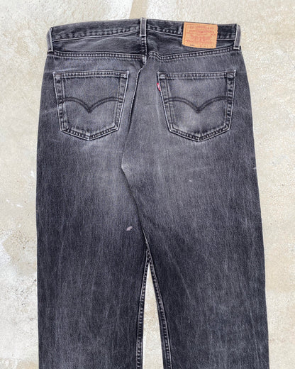 1990S FADED BLACK LEVI'S 501 PATCH JEANS (34X36)