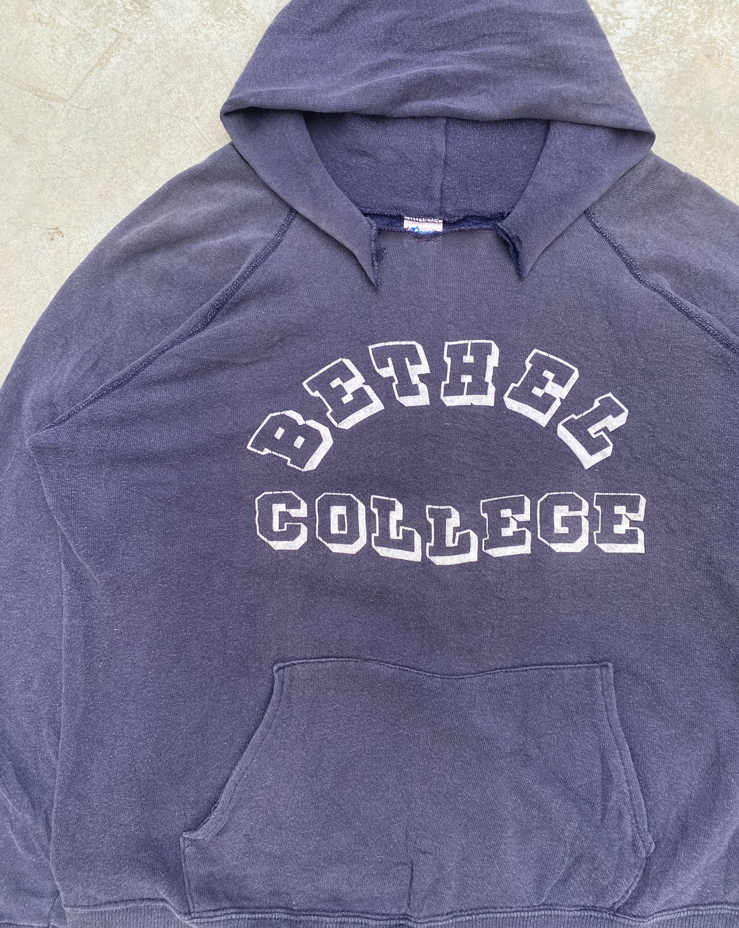1980S FADED ‘BETHEL COLLEGE’ TORN CHAMPION HOODIE (L)
