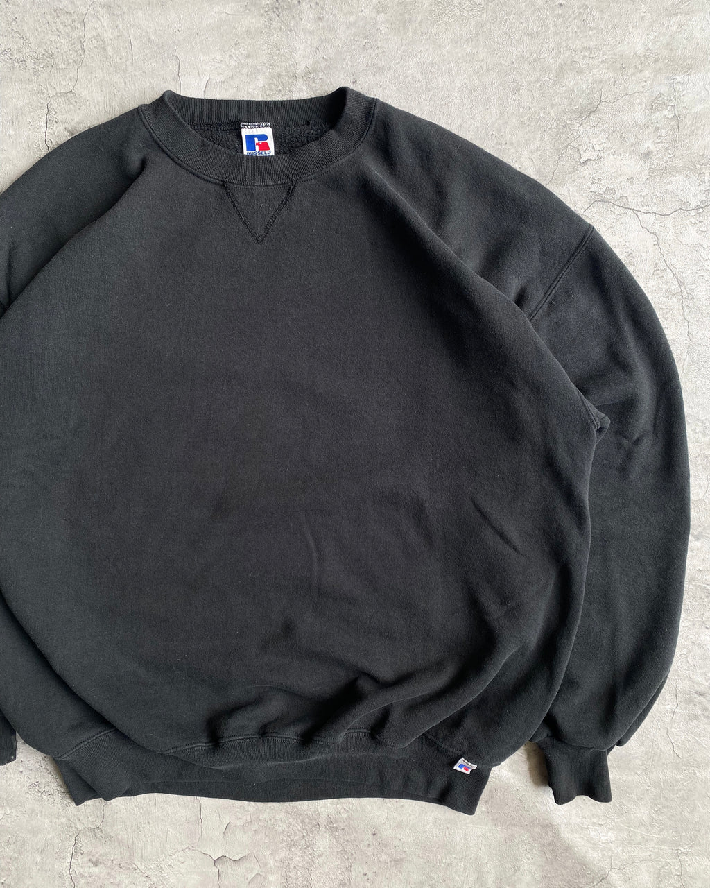 1990S RUSSELL FADED BLACK BLANK CREWNECK SWEATSHIRT (XL/XXL)