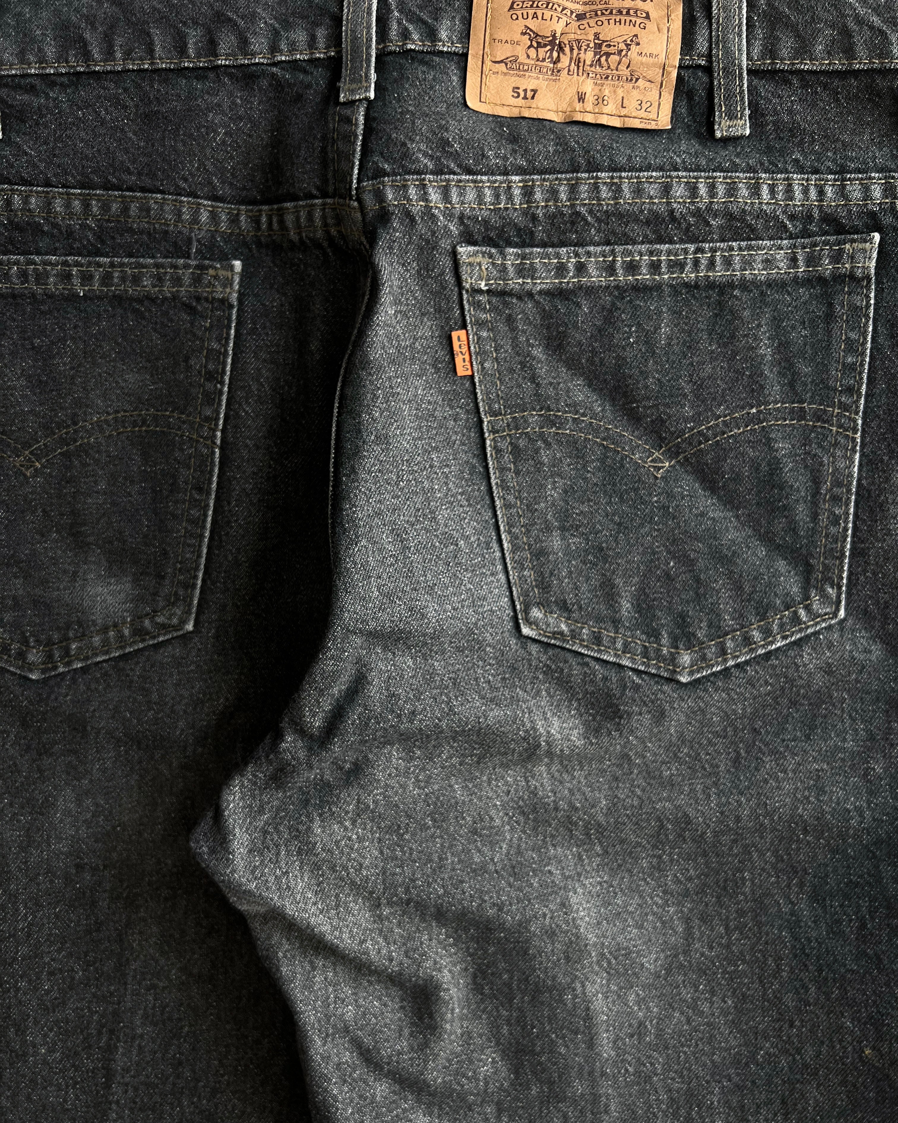 1990S FADED BLACK LEVI'S 517 FLARE JEANS (36X32)