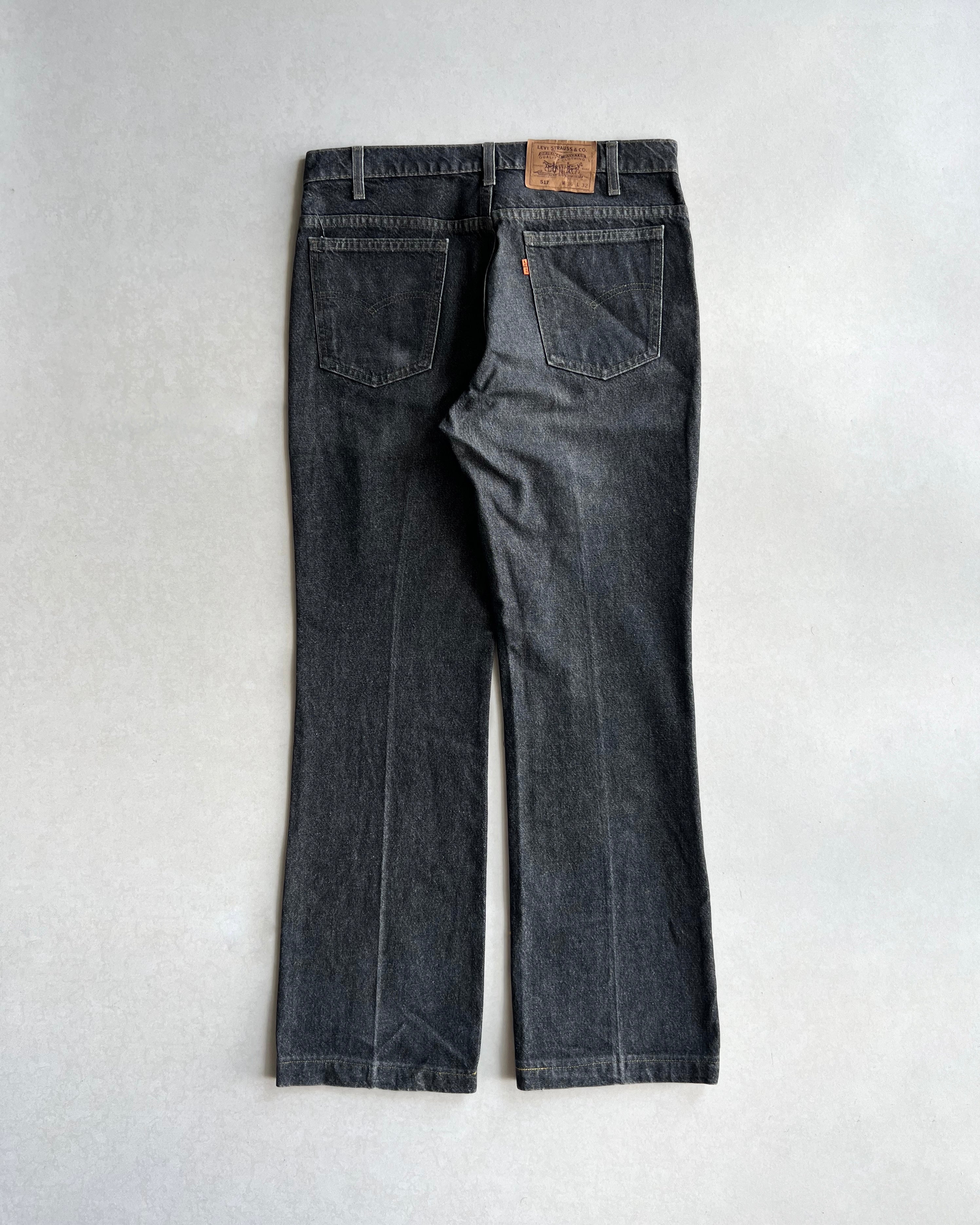 1990S FADED BLACK LEVI'S 517 FLARE JEANS (36X32)