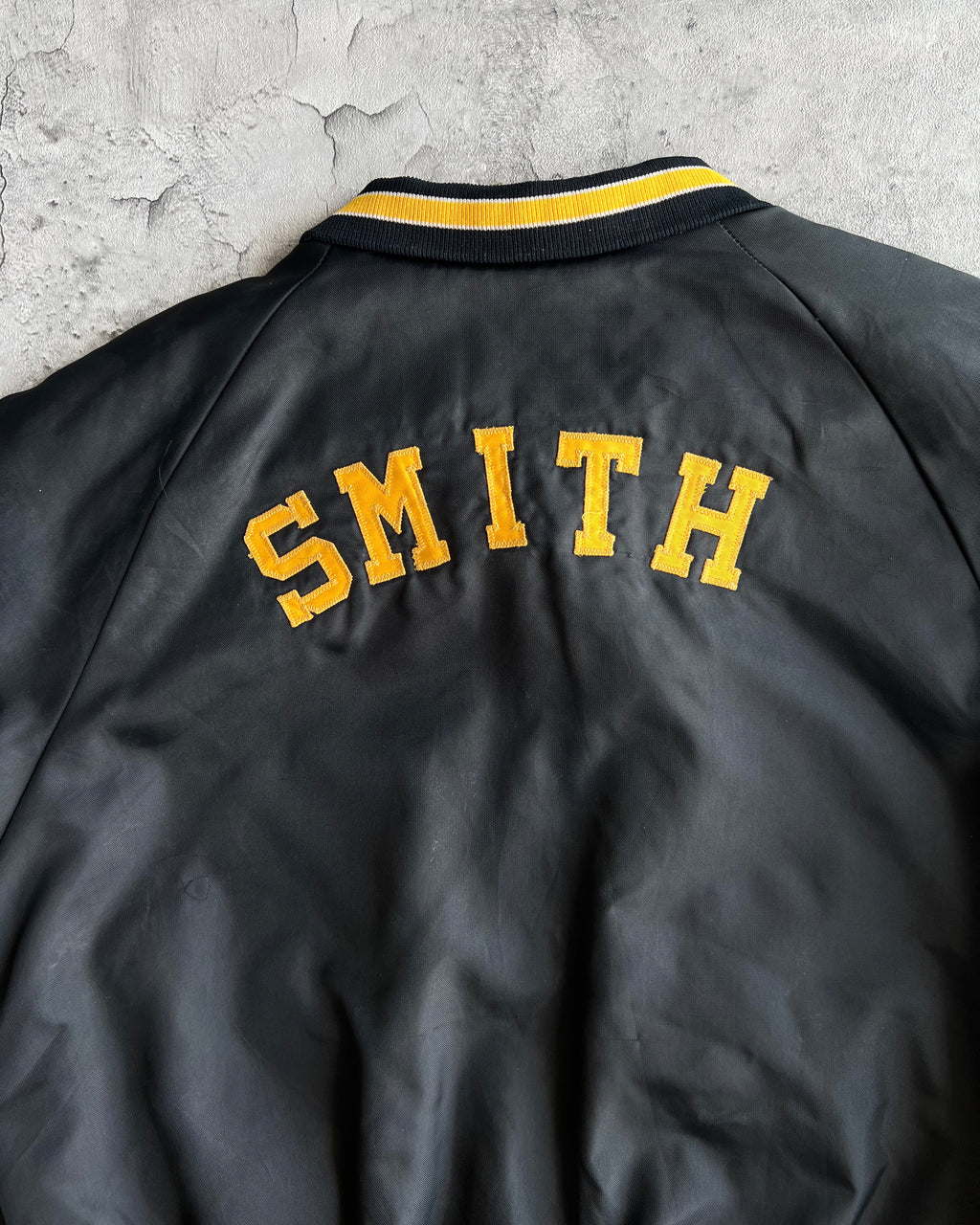 1970S BLACK 'PIRATES' RAGLAN VARSITY JACKET (L)